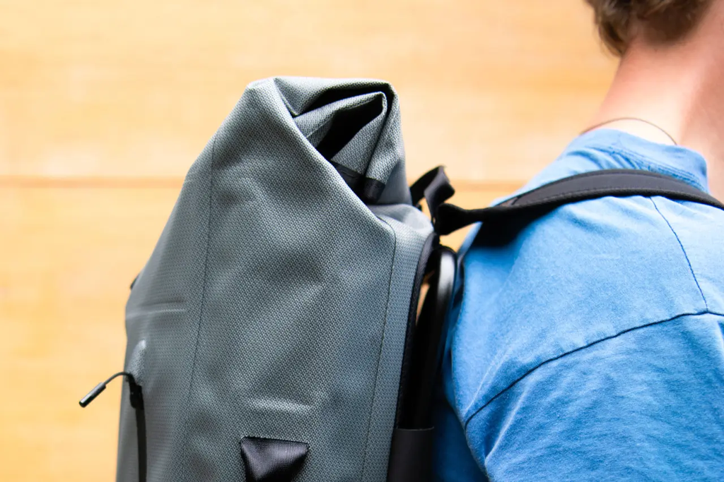 Brompton Graphite waterproog back pack - on back.webp