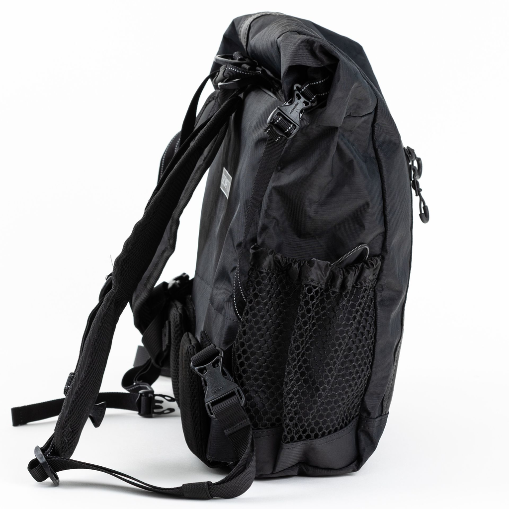 Brompton x and wander backpack - side view - stock photo.webp