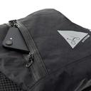 Brompton x and wander backpack showing phone in front zip pocket - stock photo.webp