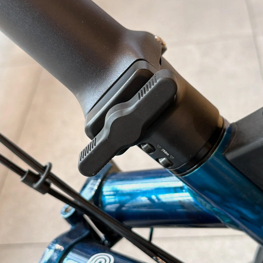 Brompton Anti Rotation Hinge Clamp | Wide | Composite | fitted to blue P Line MK2 alloy stem.webp